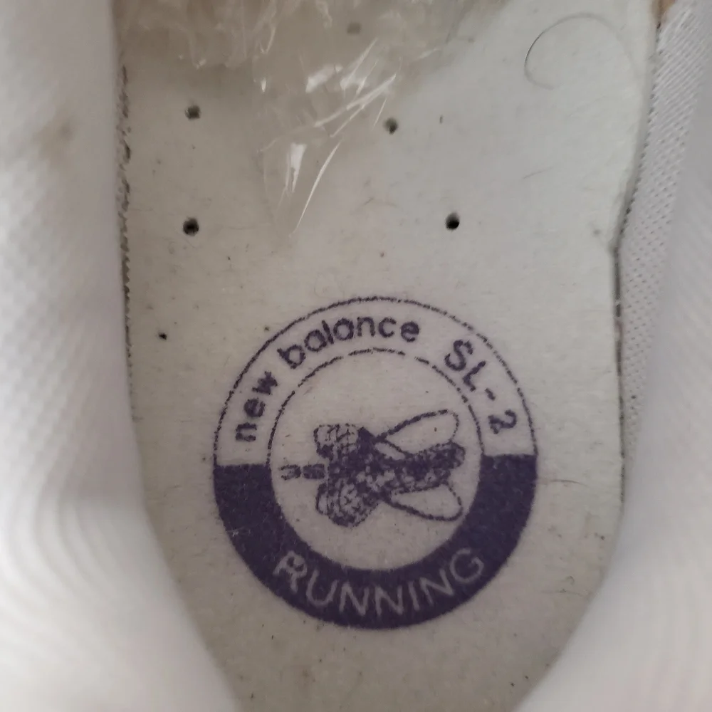 New Balance White and Silver Athletic Sneakers with Purple Accents